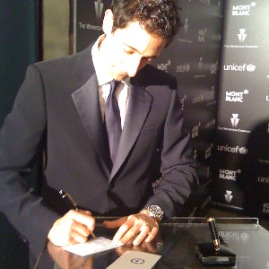 Adrian Brody signing a “wish” for the wish tree at the Montblanc/Harvey Weinstein pre–oscar party at Soho House benefitting UNICEF